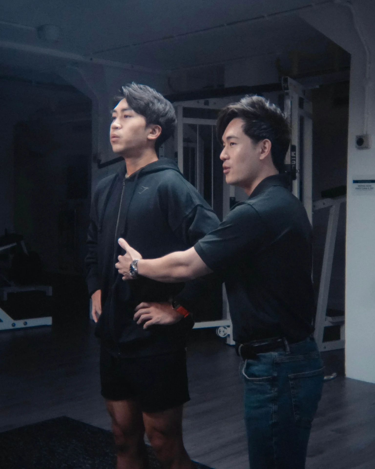 Preston coaching a client in the gym